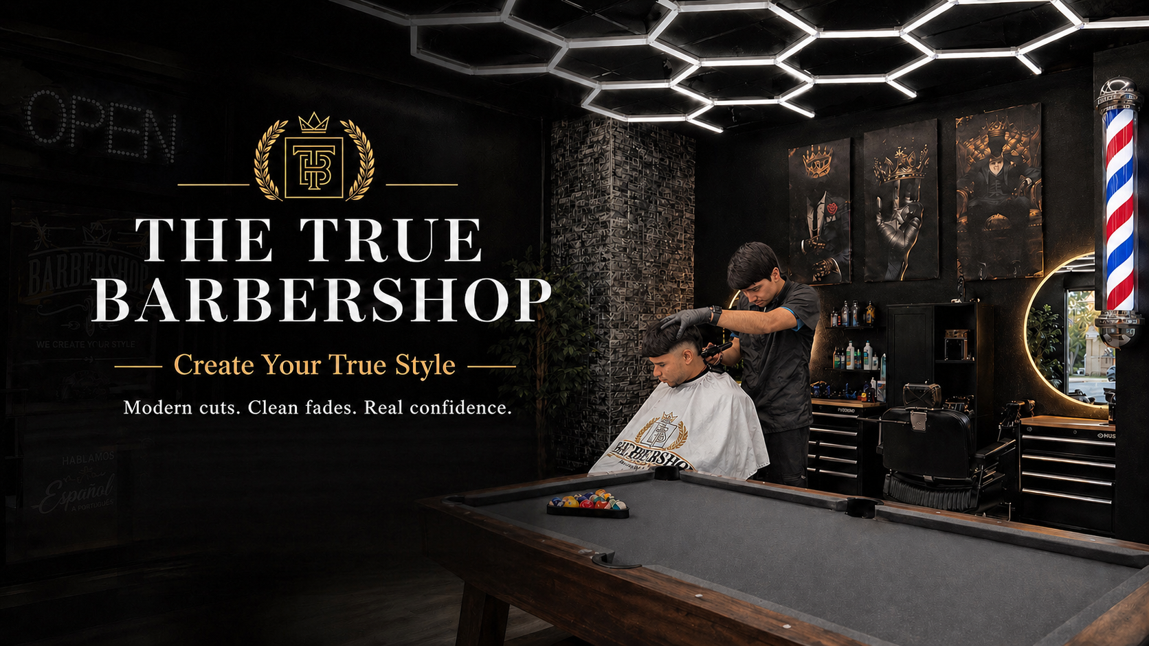 The True Barbershop interior — hexagon ceiling lights, circular LED mirrors, gold accents.